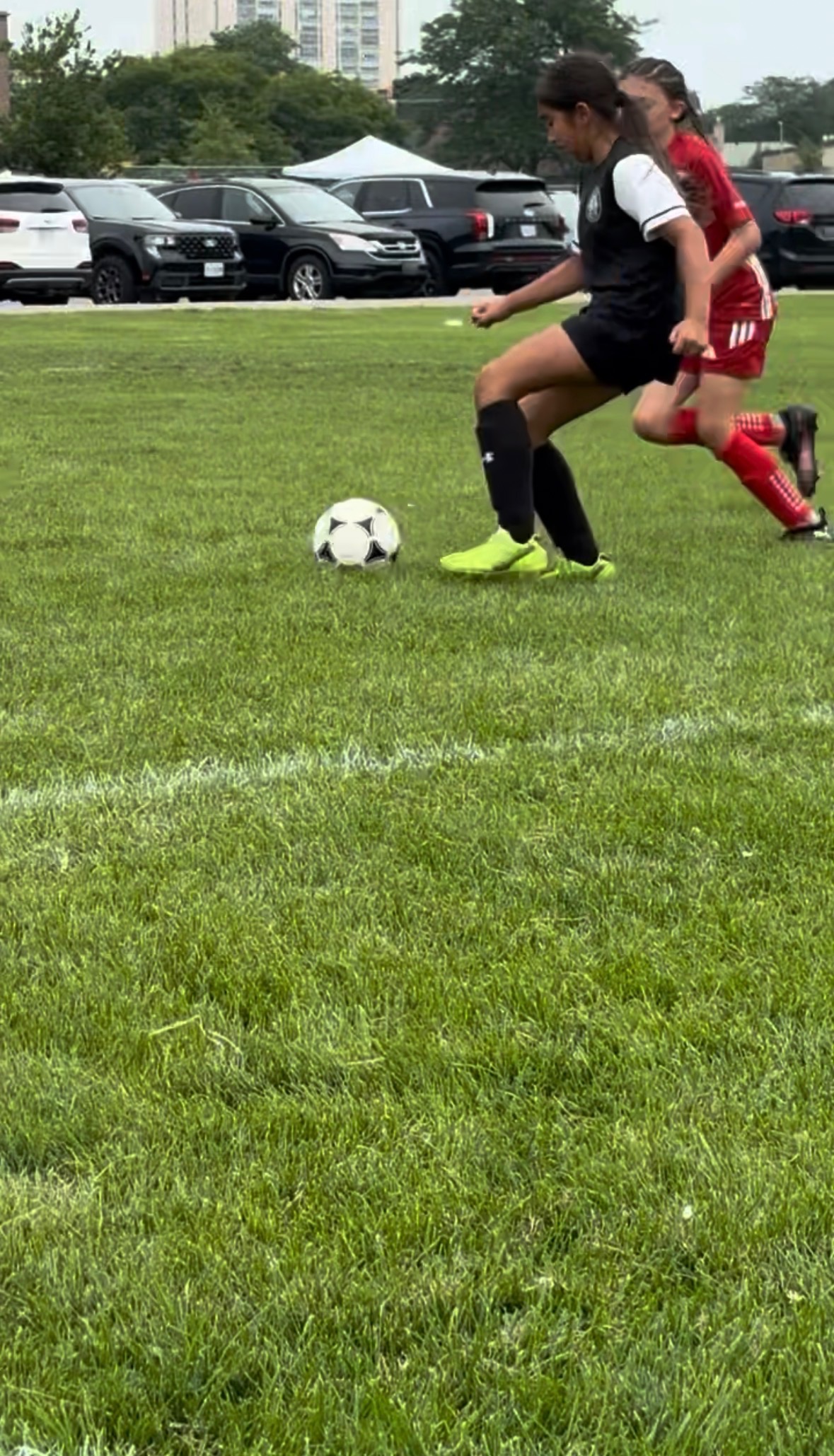Player taking a tight first touch under pressure